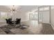 Open-concept dining room featuring a stylish chandelier and modern table setting at 4536 E Beck Ln, Phoenix, AZ 85032