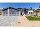 Charming single-Gathering home featuring a three-car garage, manicured landscaping, and modern design at 4536 E Beck Ln, Phoenix, AZ 85032