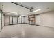 Spacious garage with epoxy floors, overhead lighting, and ample custom storage cabinets and work space at 4536 E Beck Ln, Phoenix, AZ 85032