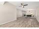 Spacious open-concept living room flowing into dining area with fireplace and wood-look tile floors at 4536 E Beck Ln, Phoenix, AZ 85032
