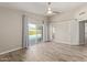 Spacious main bedroom with updated tile floors, ceiling fan, and ensuite bath and backyard access at 4536 E Beck Ln, Phoenix, AZ 85032