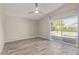 Spacious main bedroom with updated tile floors, ceiling fan, and sliding glass door to the private pool at 4536 E Beck Ln, Phoenix, AZ 85032