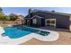 Inviting backyard with a refreshing pool and well-maintained gravel landscaping at 4536 E Beck Ln, Phoenix, AZ 85032