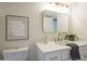 Modern bathroom features a marble counter top, gold fixtures, vanity lighting, and decorative painting at 4901 S Calle Los Cerros Dr # 236, Tempe, AZ 85282