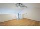 Open bonus room with wood-look floors, vaulted ceilings, and upstairs loft design at 4901 S Calle Los Cerros Dr # 236, Tempe, AZ 85282