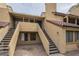 Southwest-style townhome featuring a private entrance with stairs leading to the unit's front door at 4901 S Calle Los Cerros Dr # 236, Tempe, AZ 85282