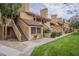 Charming townhome featuring traditional Southwest architecture, red tile roof, and well-maintained landscaping at 4901 S Calle Los Cerros Dr # 236, Tempe, AZ 85282