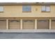 Multi-car garage featuring stucco exterior, multiple entry doors, and traditional garage doors at 4901 S Calle Los Cerros Dr # 236, Tempe, AZ 85282