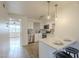 Bright kitchen features updated appliances, subway tile backsplash, and peninsula seating area at 4901 S Calle Los Cerros Dr # 236, Tempe, AZ 85282