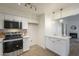 Bright kitchen features updated appliances and opens to a cozy living room with fireplace at 4901 S Calle Los Cerros Dr # 236, Tempe, AZ 85282