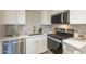 The modern kitchen features stainless steel appliances, white cabinets, and a stylish backsplash at 4901 S Calle Los Cerros Dr # 236, Tempe, AZ 85282