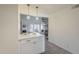 Bright kitchen with modern pendant lighting and an opening that overlooks a living area at 4901 S Calle Los Cerros Dr # 236, Tempe, AZ 85282