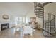 Inviting living room featuring a fireplace, spiral staircase, and contemporary decor for a cozy, modern ambiance at 4901 S Calle Los Cerros Dr # 236, Tempe, AZ 85282