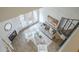 Open concept living area featuring wood-look tile floors, fireplace, spiral staircase, and bright white decor at 4901 S Calle Los Cerros Dr # 236, Tempe, AZ 85282