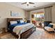 Serene main bedroom featuring a plush bed, sliding glass doors to the backyard, and ample natural light at 4919 E Morning Vista Ln, Cave Creek, AZ 85331