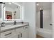 Modern bathroom with stylish vanity, white cabinets, and a shower/tub combo at 5209 N 24Th St # 104, Phoenix, AZ 85016