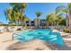 Sparkling community pool with lounge chairs and well maintained landscaping surrounding at 5209 N 24Th St # 104, Phoenix, AZ 85016