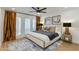Serene primary bedroom with large windows, natural light, and sophisticated decor at 5209 N 24Th St # 104, Phoenix, AZ 85016