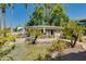 Charming pool house nestled amidst lush landscaping with a pond and outdoor seating at 5209 N 24Th St # 104, Phoenix, AZ 85016