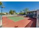 Well-maintained tennis courts with a view of lush landscaping and blue sky at 5209 N 24Th St # 104, Phoenix, AZ 85016
