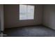 Bedroom with neutral paint, plush carpet, a window with blinds, and an electrical outlet at 5335 E Shea Blvd # 1035, Scottsdale, AZ 85254