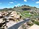 Aerial view of the Tuscan community with a golf course and mountain views at 5370 S Desert Dawn Dr # 50, Gold Canyon, AZ 85118