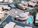 Aerial view of the community featuring a clubhouse, pool, and well manicured landscaping at 5370 S Desert Dawn Dr # 50, Gold Canyon, AZ 85118