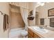 Bathroom featuring a bathtub, vanity with sink, and decorative accents for a functional space at 5370 S Desert Dawn Dr # 50, Gold Canyon, AZ 85118