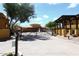 Gated community entrance with decorative iron work and desert landscaping at 5370 S Desert Dawn Dr # 50, Gold Canyon, AZ 85118