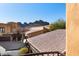 Scenic exterior view featuring rooftops and desert mountain views from a rear balcony at 5370 S Desert Dawn Dr # 50, Gold Canyon, AZ 85118