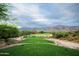 Picturesque golf course view with lush green fairway and mountain backdrop, perfect for outdoor enthusiasts at 5370 S Desert Dawn Dr # 50, Gold Canyon, AZ 85118