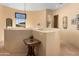 Elegant hallway with a decorative window and architectural details, showcasing the home's character at 5370 S Desert Dawn Dr # 50, Gold Canyon, AZ 85118