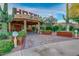 Charming hotel entrance with desert-themed landscaping, creating a welcoming atmosphere for guests at 5370 S Desert Dawn Dr # 50, Gold Canyon, AZ 85118