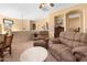 Cozy living room with comfortable seating and warm, inviting decor with easy access to the hallway at 5370 S Desert Dawn Dr # 50, Gold Canyon, AZ 85118