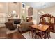 Bright living room boasts high ceilings, a fireplace, and a mix of stylish and antique furnishings at 5370 S Desert Dawn Dr # 50, Gold Canyon, AZ 85118