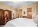 Bedroom boasting warm neutral walls and accents, hardwood flooring, and wood-paneled doors at 5370 S Desert Dawn Dr # 50, Gold Canyon, AZ 85118