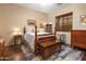 Cozy bedroom features a four poster bed, dresser, and a ceiling fan at 5370 S Desert Dawn Dr # 50, Gold Canyon, AZ 85118