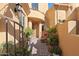 Charming courtyard with plants, bench seating and a stone pathway to the front door at 5370 S Desert Dawn Dr # 50, Gold Canyon, AZ 85118