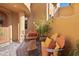Private courtyard with comfortable seating, potted plants, and a stone pathway at 5370 S Desert Dawn Dr # 50, Gold Canyon, AZ 85118