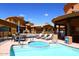 Community pool with jacuzzi and lounge seating; perfect for relaxation at 5370 S Desert Dawn Dr # 50, Gold Canyon, AZ 85118