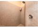 Tiled shower stall features neutral tiles and a modern shower head at 5370 S Desert Dawn Dr # 50, Gold Canyon, AZ 85118