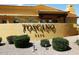 Community entrance signage for Toscano Villas, with manicured landscaping at 5370 S Desert Dawn Dr # 50, Gold Canyon, AZ 85118