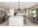 Spacious kitchen with stainless steel refrigerator, large marble island, and a nearby dining area at 544 E Amber Sun Dr, Phoenix, AZ 85086