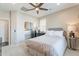 Bright bedroom with a large window, mirrored closet, and neutral decor at 623 E Peach Tree St, Queen Creek, AZ 85140