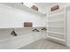 An organized walk-in closet featuring ample shelving and hanging space, perfect for maximizing storage and keeping items tidy at 623 E Peach Tree St, Queen Creek, AZ 85140