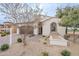 Charming single-story home showcasing desert landscaping and a two car garage at 623 E Peach Tree St, Queen Creek, AZ 85140
