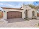 Charming home featuring a tile roof, stucco walls, and a paved driveway at 623 E Peach Tree St, Queen Creek, AZ 85140