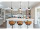Modern kitchen featuring an island with bar stools, and pendant lighting at 623 E Peach Tree St, Queen Creek, AZ 85140