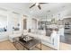 Open concept floor plan showcasing the living room and kitchen, offering a bright and airy feel at 623 E Peach Tree St, Queen Creek, AZ 85140