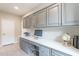 Office space featuring custom built-in cabinets, a large desktop, and neutral flooring at 623 E Peach Tree St, Queen Creek, AZ 85140